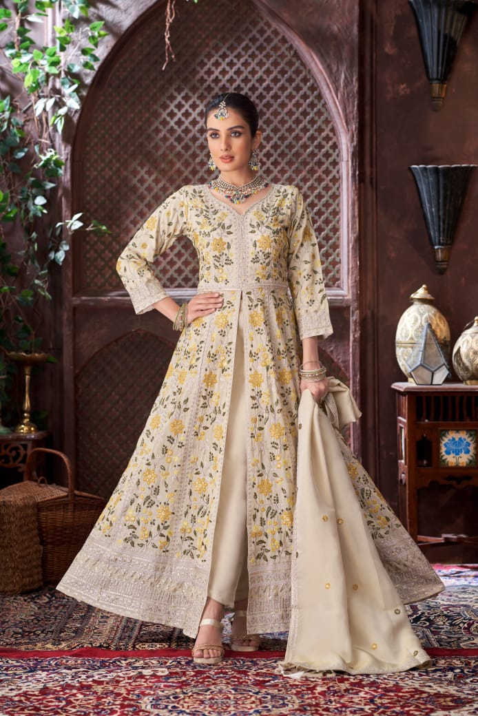 Sherni London off-white light gold floral jacket trouser salwar kameez with front split, tissue georgette dupatta and yellow and green threadwork flowers all over.