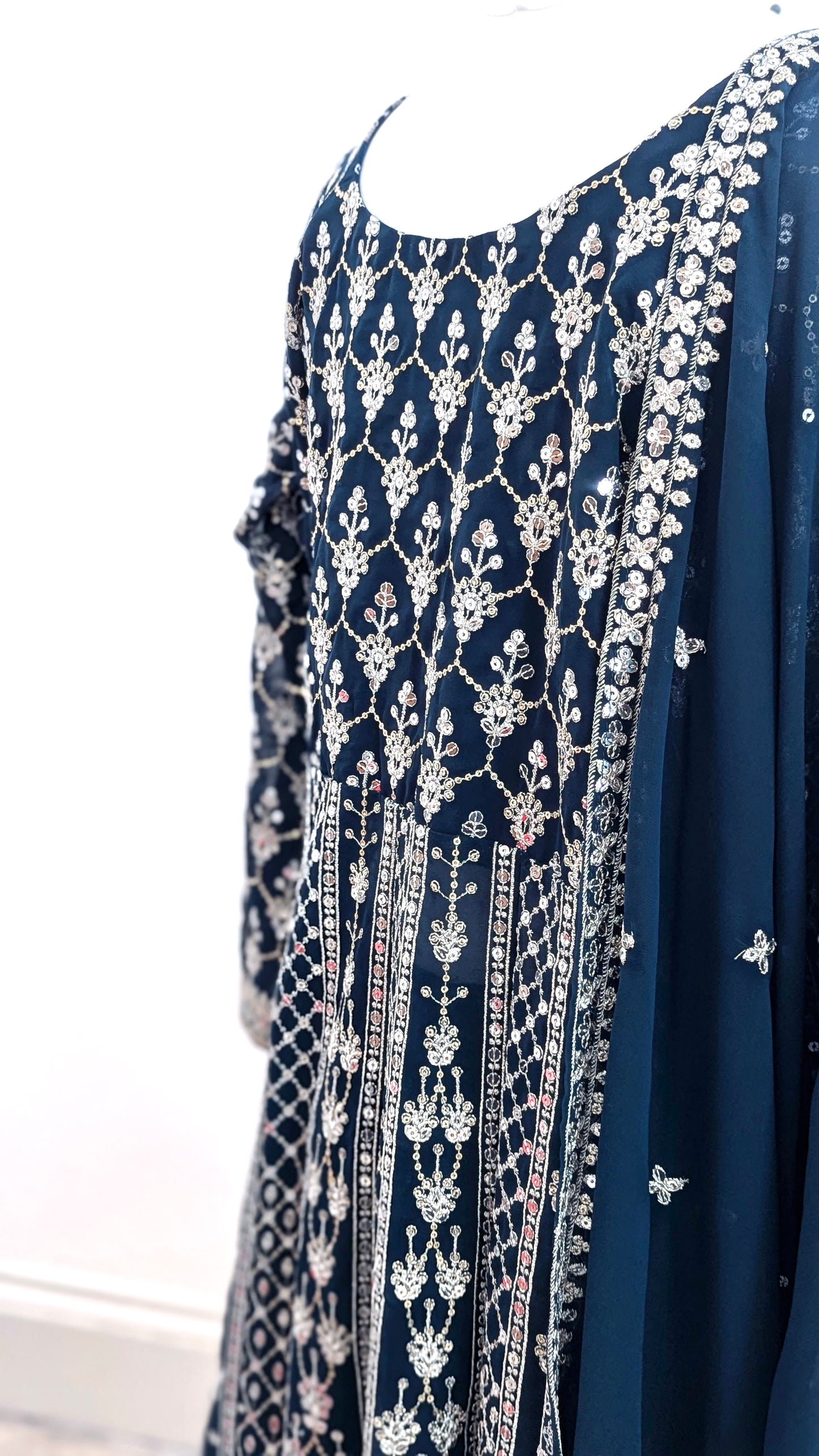 Mannequin in a teal Sherni London palazzo jacket set with front split all over silver embroidery and a dupatta