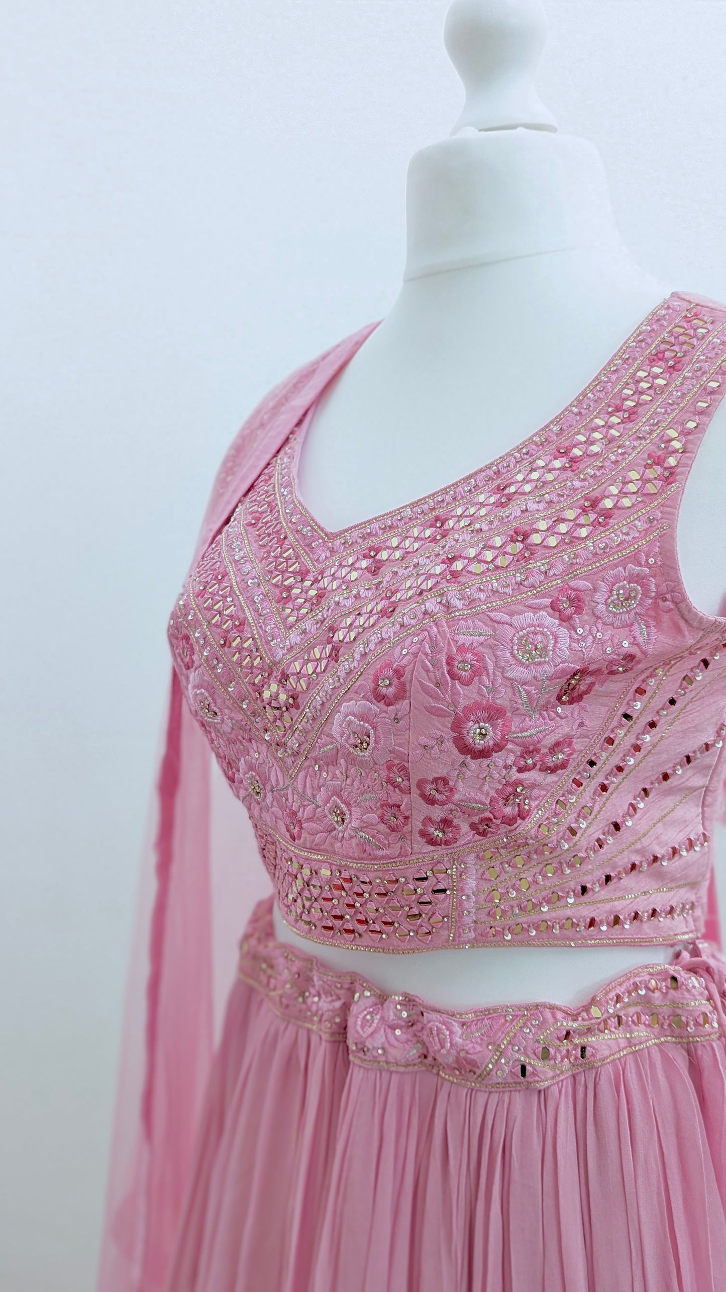 Pink ombre lehenga with delicate gold embroidery in soft georgette with a net dupatta