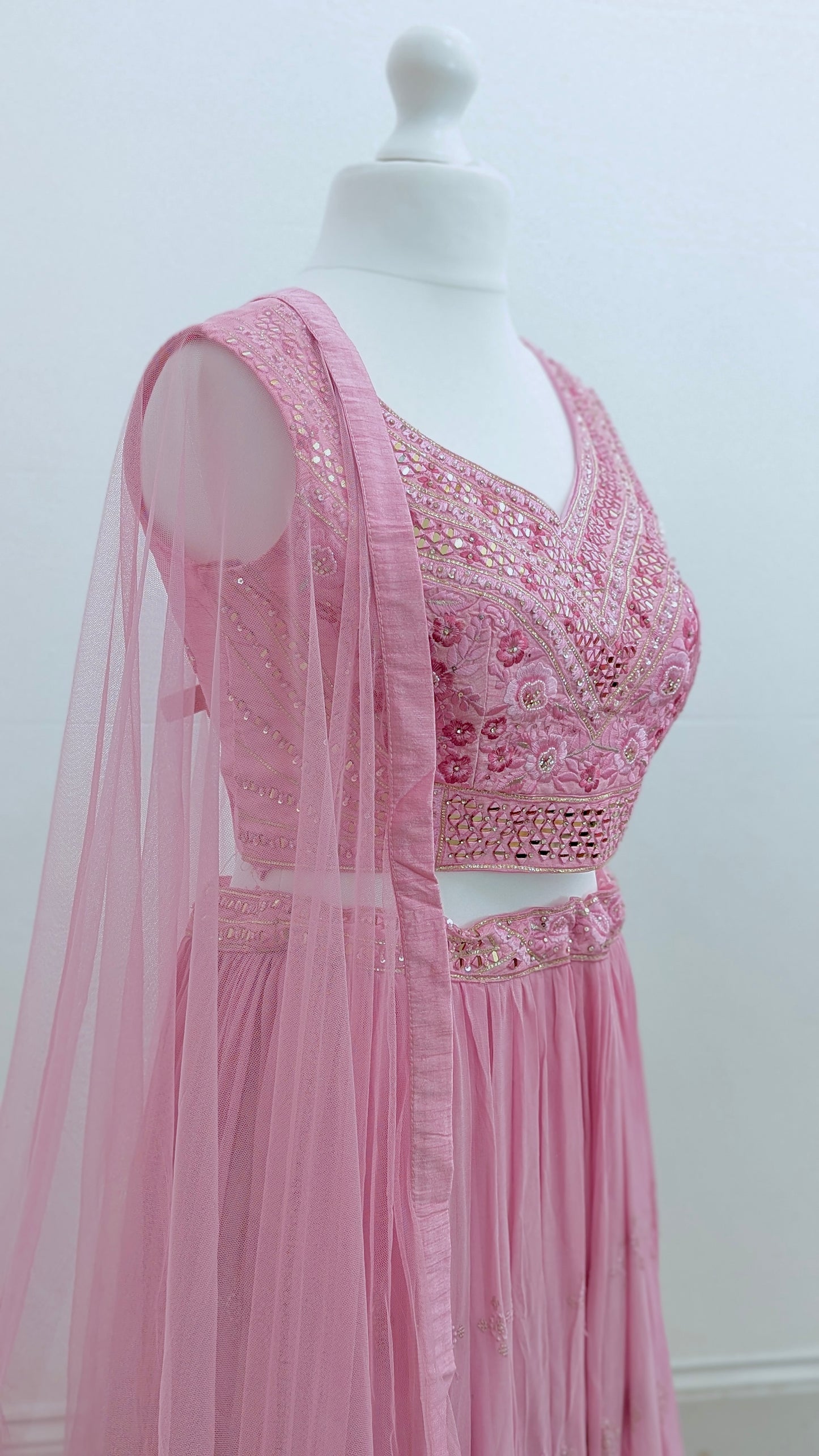 Pink ombre lehenga with delicate gold embroidery in soft georgette with a net dupatta