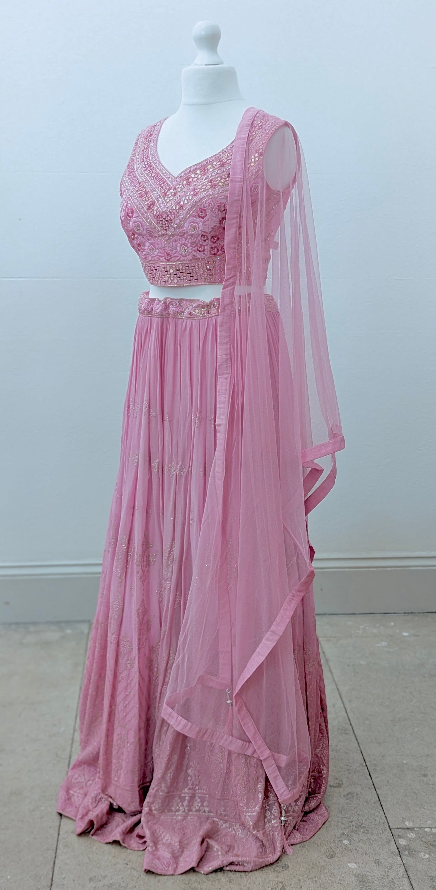Pink ombre lehenga with delicate gold embroidery in soft georgette with a net dupatta