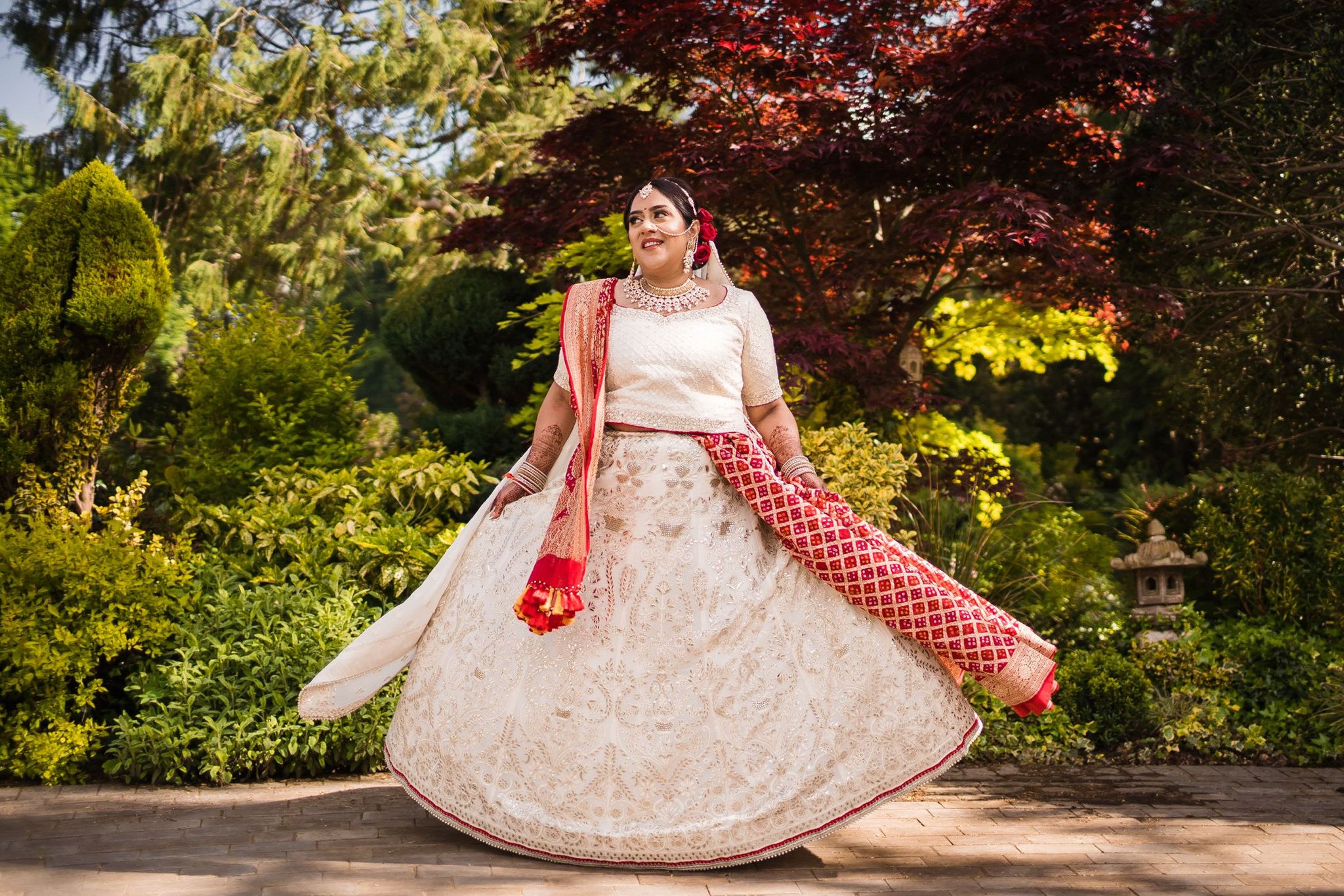 Sherni London bride in cream chikankari lucknowi work Indian lehenga twirling