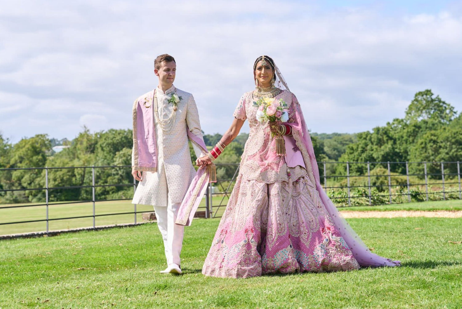 Sherni London Pink bespoke lehenga with peacocks and two tone colour on a bride and groom fusion wedding