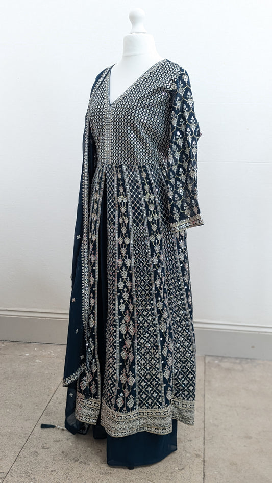 Mannequin in a teal Sherni London palazzo jacket set with front split all over silver embroidery and a dupatta