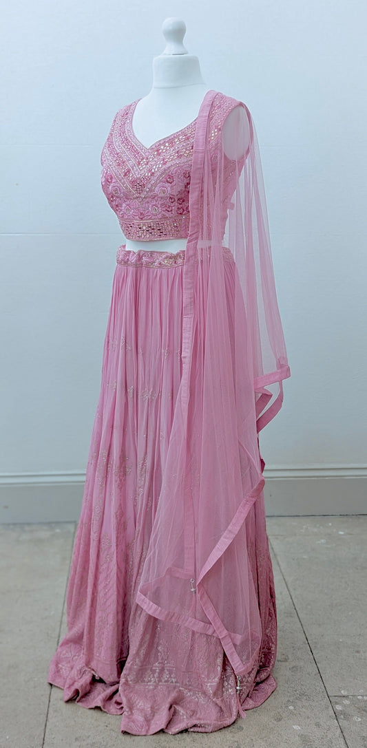 Pink ombre lehenga with delicate gold embroidery in soft georgette with a net dupatta