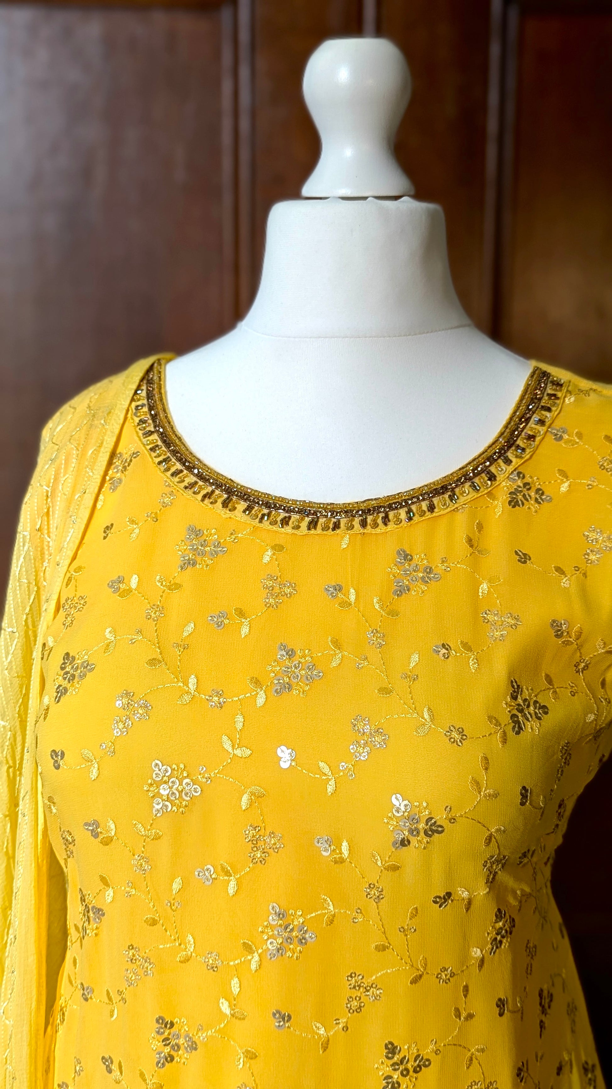 Yellow Punjabi palazzo suit with attachable sleeves and dupatta in georgette and tone on tone yellow floral embroidery with hand embroidery on neckline