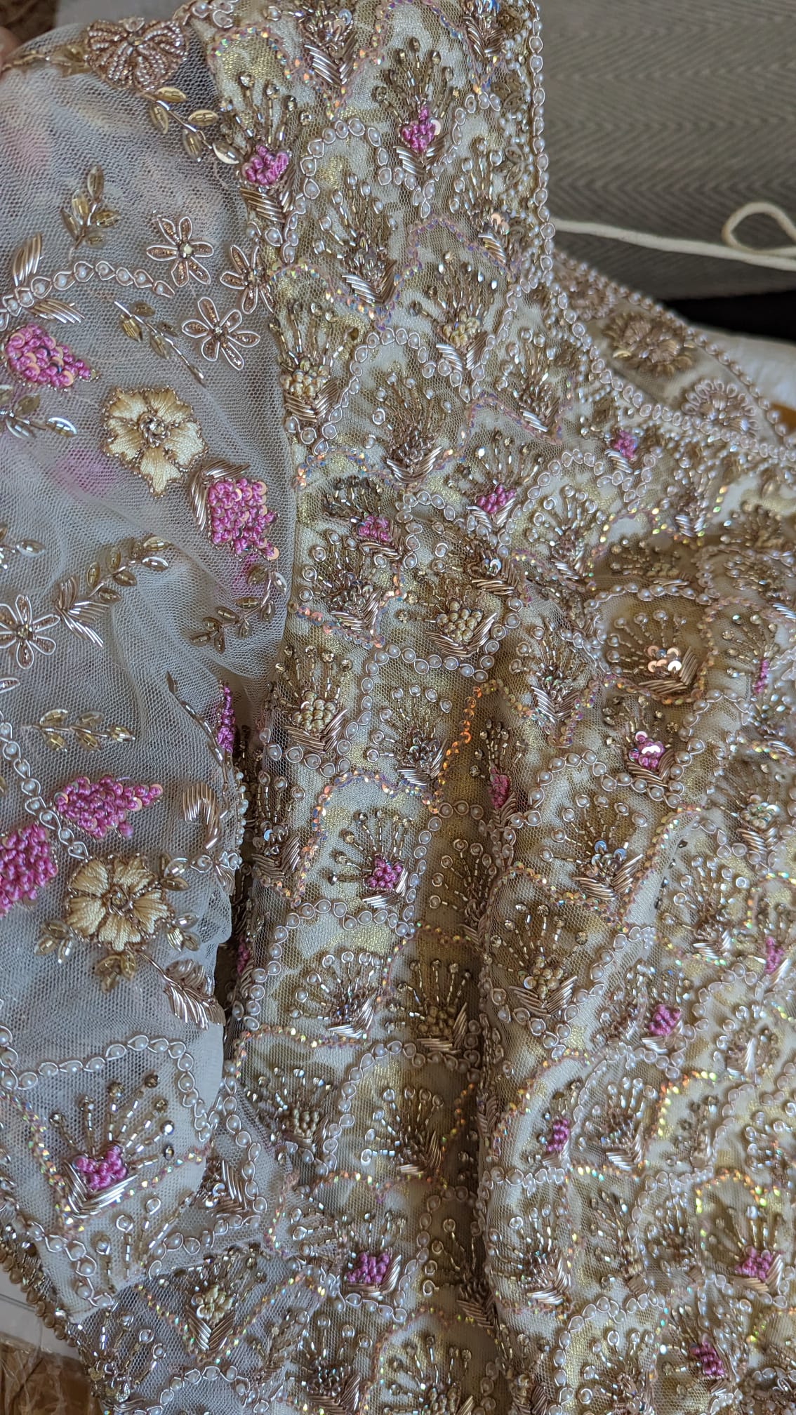 Close-up of intricately embroidered fabric with floral patterns for Sherni London Indian bridal lehenga