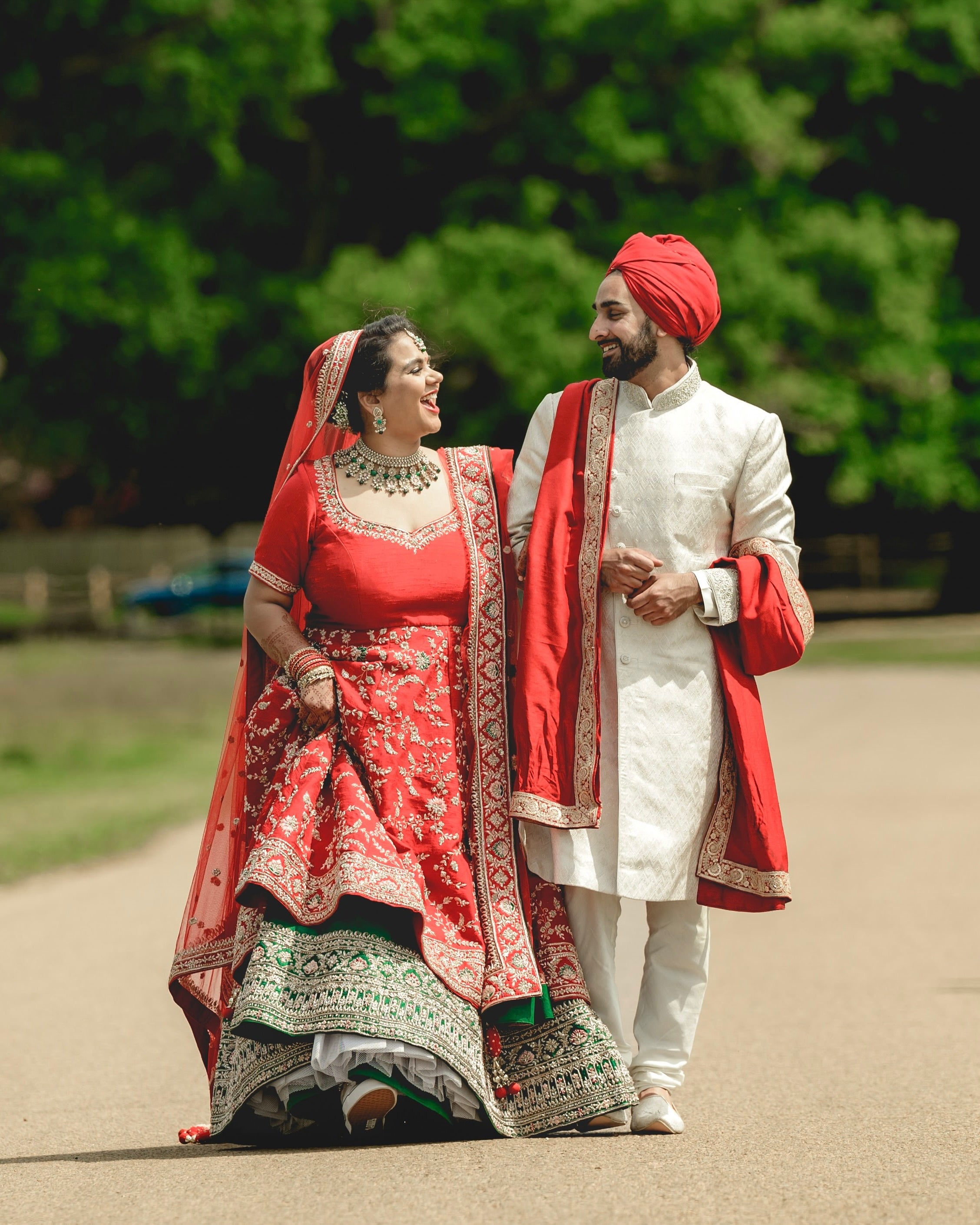 Sherni London Indian bride in double layer red and green bridal lehenga with double dupatta